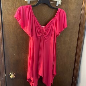 Bright pink blouse , lower cut
